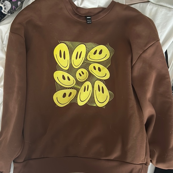 brown smiley face sweatshirt